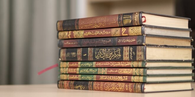 a stack of books sitting on top of a table