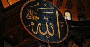 a large sign hanging from the side of a building