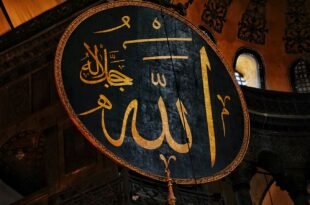 a large sign hanging from the side of a building