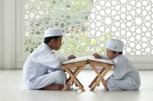 man in white thobe sitting on white floor tiles