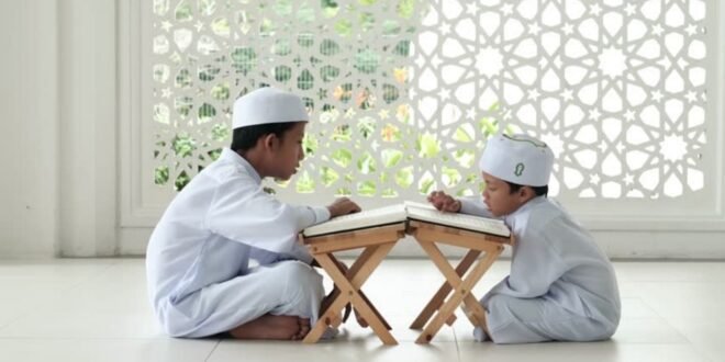 man in white thobe sitting on white floor tiles