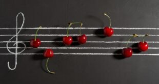 red cherries on black surface