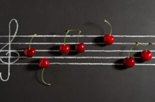 red cherries on black surface