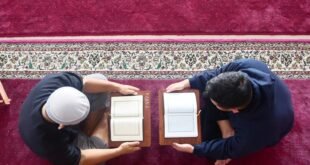 a couple of men painting