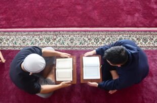 a couple of men painting