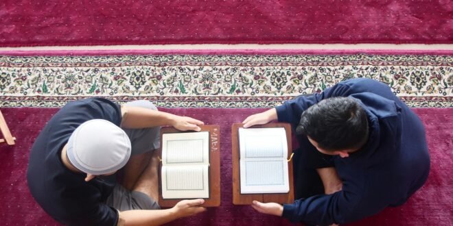 a couple of men painting